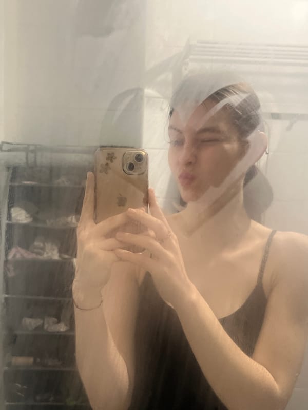 Woman takes selfies with gold iPhone in Saint Petersburg