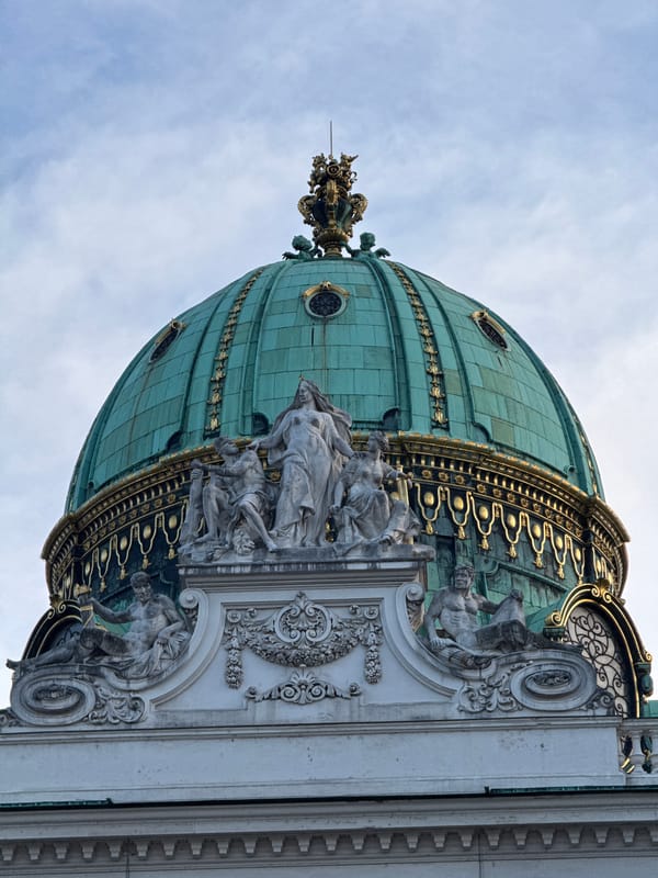 Vienna's grand domes and Baroque facades on a cloudy afternoon