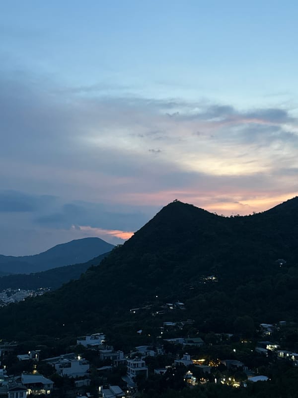 Sunset sweeps over Nha Trang's green hills and coastal sprawl