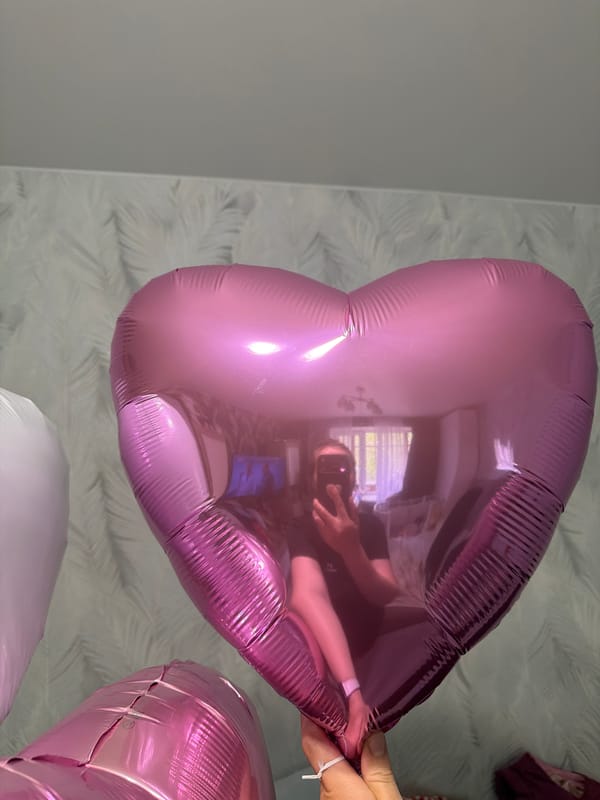 Pink heart balloon photographed in Staraya, Russia