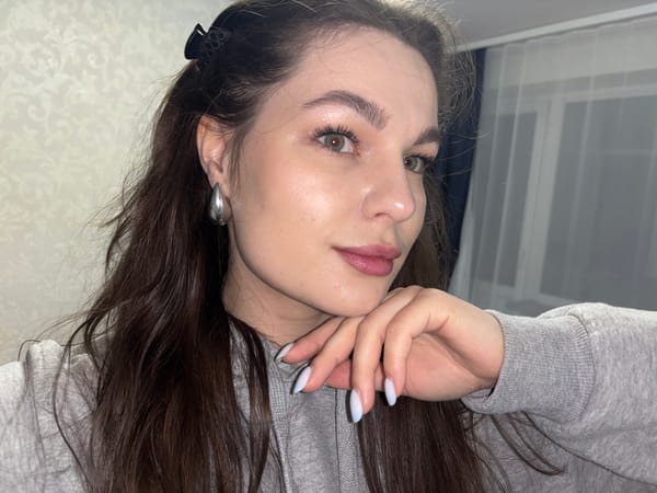Woman takes selfies with cat in Chaikovsky home
