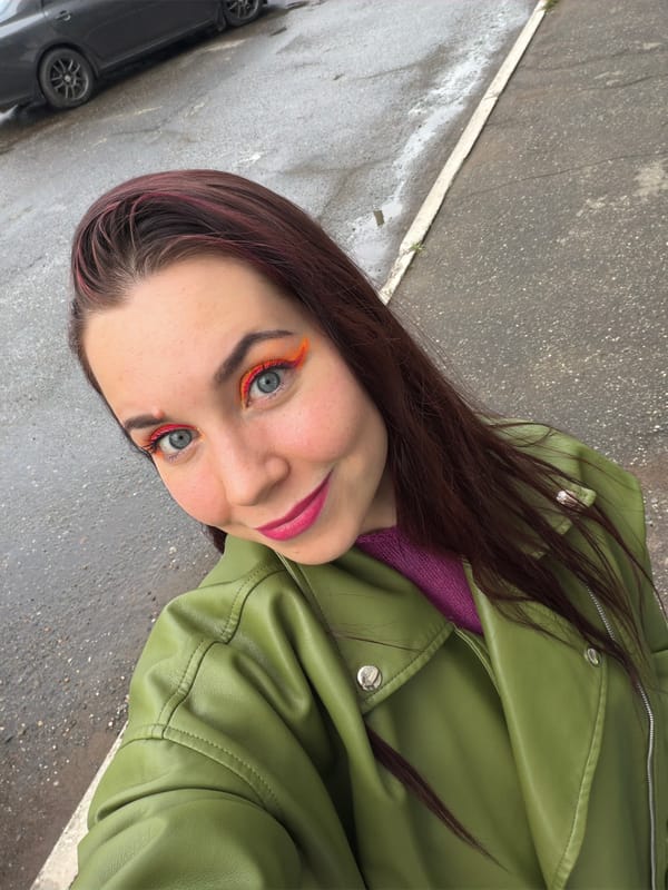 Outdoor selfie with bold makeup and colorful style in Chaikovsky