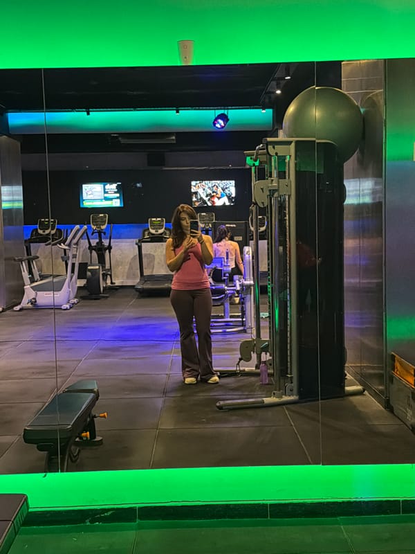 Man spotted at gym, examining wall documents in Buenos Aires