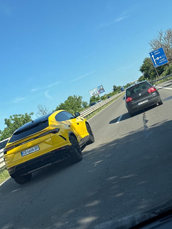 Luxury and everyday vehicles spotted across highway and parking areas