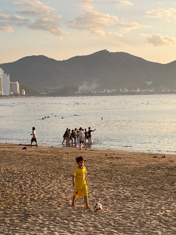 Evening beach gathering captured in Nha Trang, Vietnam