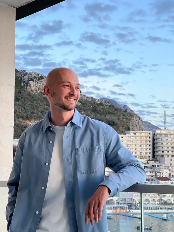 Man photographed on balcony overlooking Adriatic coast Montenegro