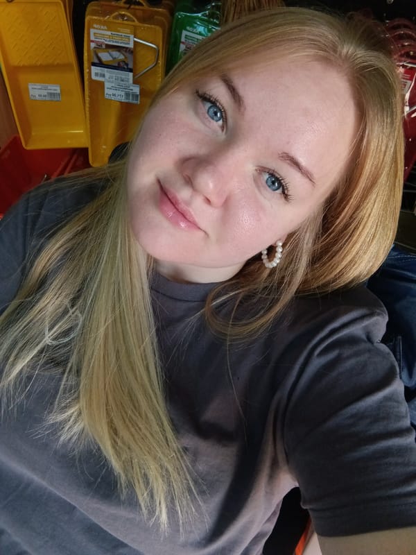 Woman takes selfie in art supply store