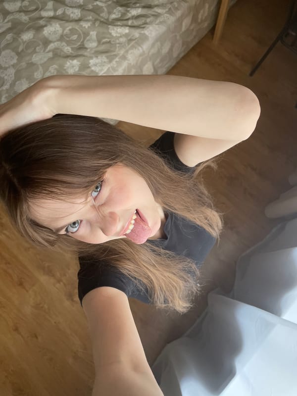 Woman takes selfies indoors in Ufa, Russia