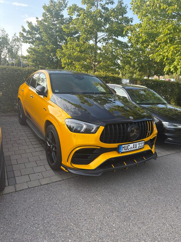 Yellow AMG and silver McLaren parked in Ingolstadt