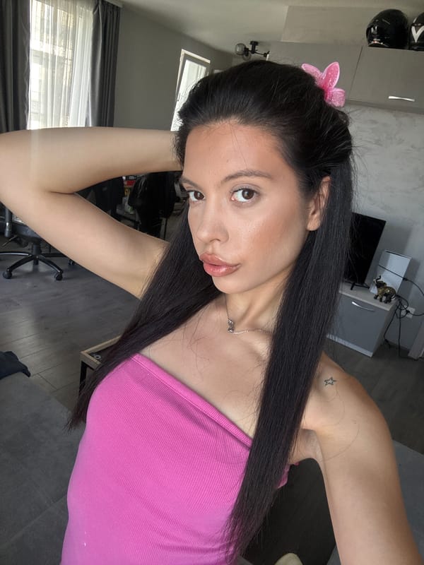 Indoor selfie moment in a Sofia apartment, pink butterfly clip.