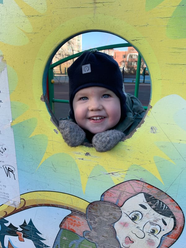 Child plays at Saint Petersburg playground during morning hours