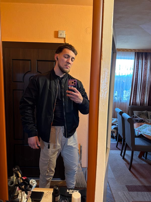 Man takes mirror selfie with eyes closed in Tsarevo home