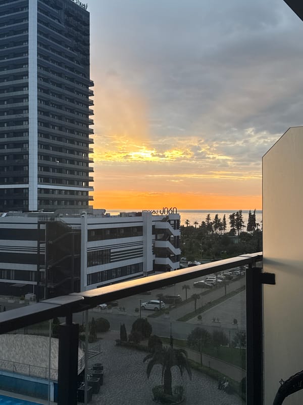 Batumi sunset documented from high-rise balcony overlooking Black Sea