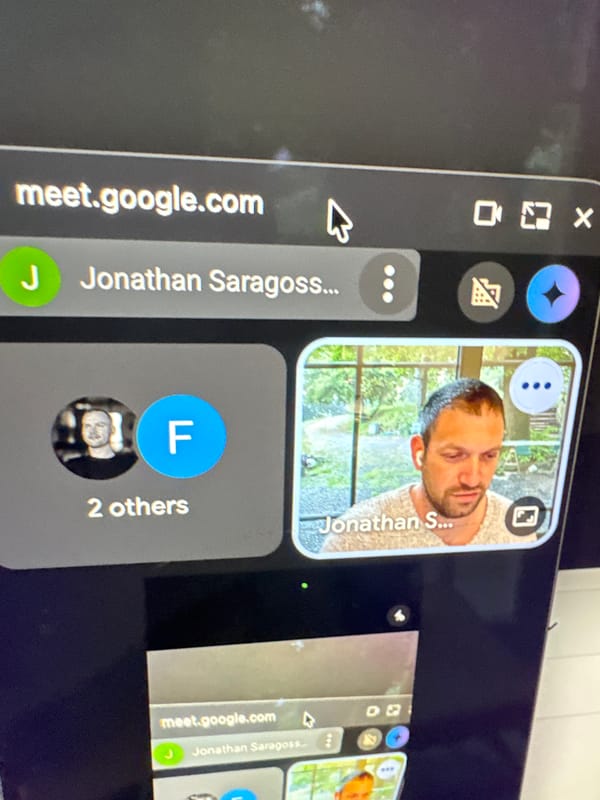 Google Meet video call captured on screen in Erba
