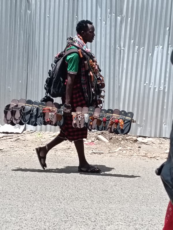 Dog spotted sitting in Nairobi, Kenya