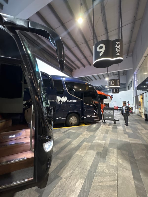 Passenger waits at Puebla bus terminal platform