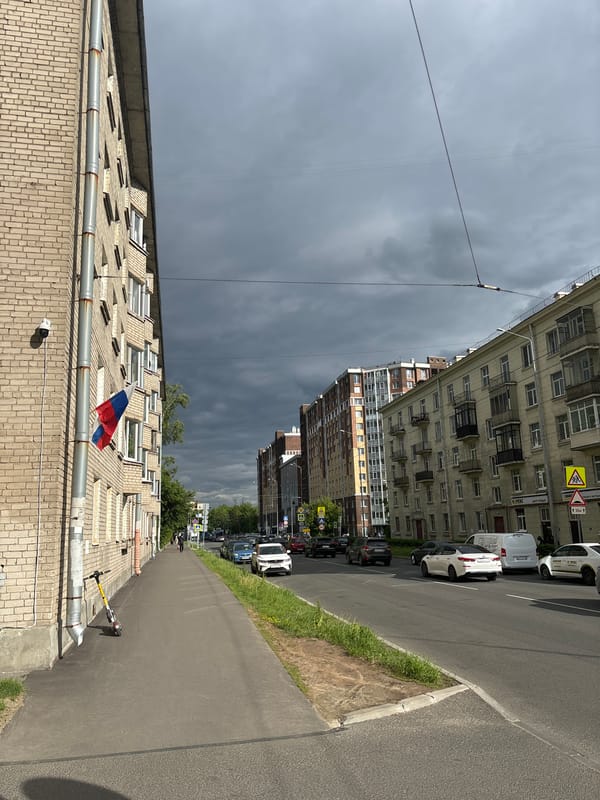 Blonde woman documents afternoon activities across urban Russian location