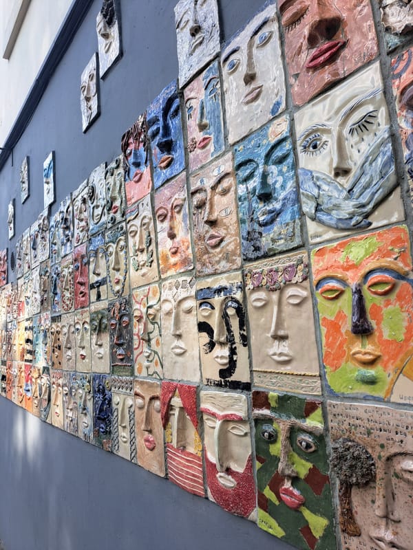 Ceiling art installation with sculpted faces spotted in Yerevan