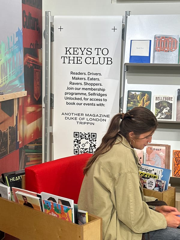 Woman browses magazines at London newsstand