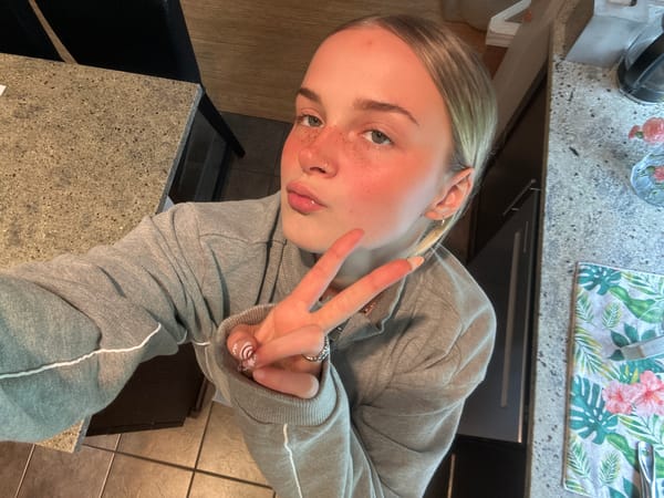 Person takes peace sign selfie in Whistler
