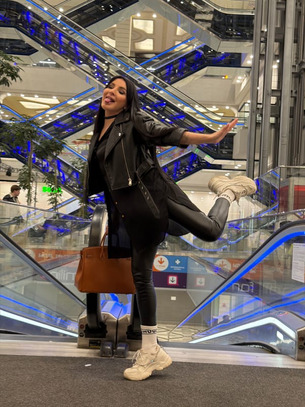 Woman takes playful selfies throughout Voronezh shopping mall