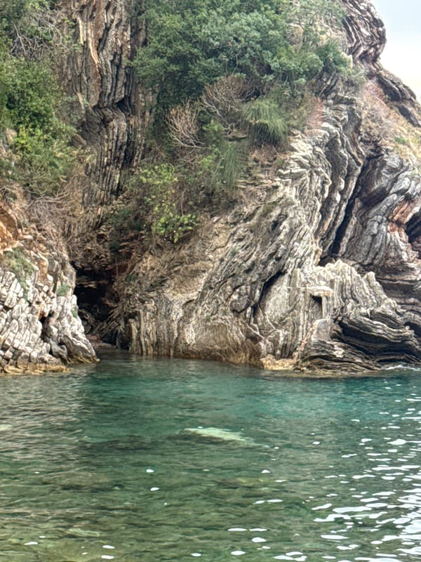 Rocky caves, clear coves, and coastline around Rafailovići, Montenegro