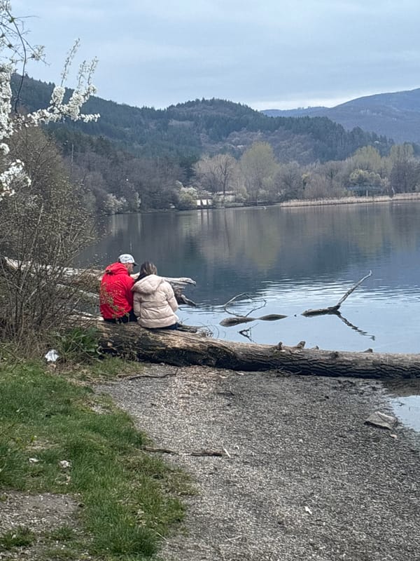 Two people rest lakeside at Bulgaria's Lake Pancharevo