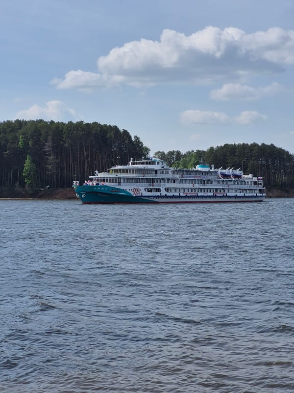 Couple documents romantic visit to Chaikovsky waterfront, cruise ships docked