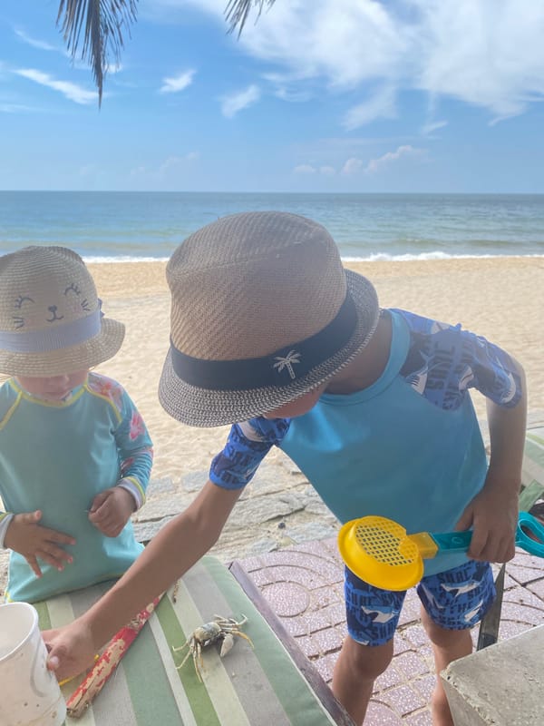 Kids and a crab at the Mũi Né shore