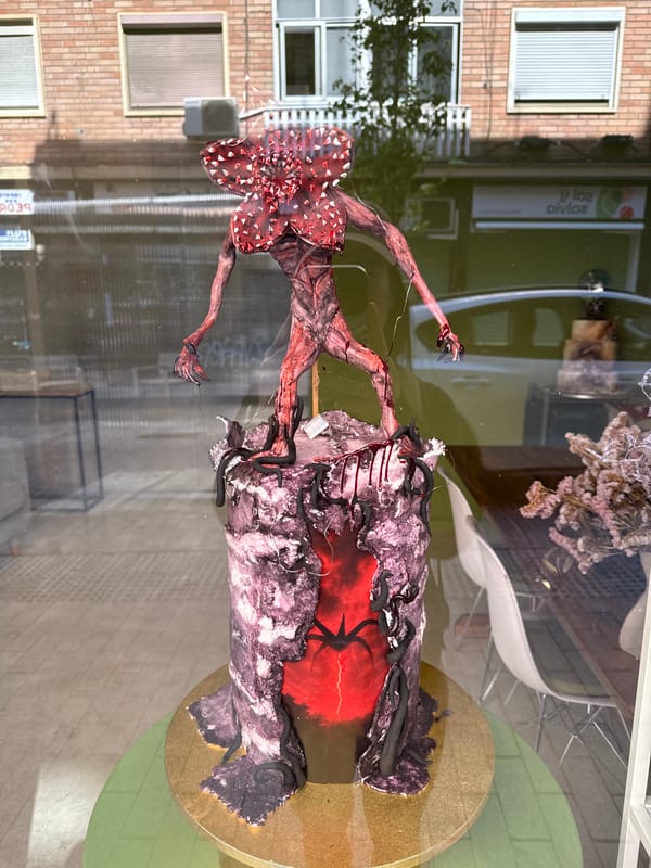 Urban scenes documented in Barcelona including TV character display