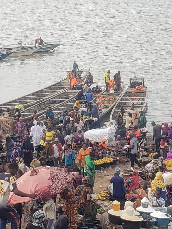 Busy riverside markets and boat transport documented in Lokoja