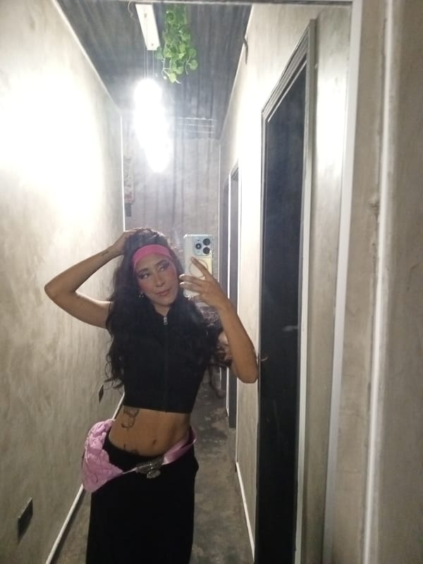 Woman Takes Mirror Selfie in Hallway