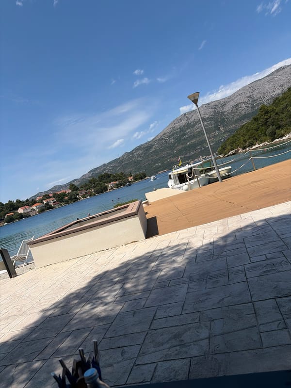 Sunny waterfront dining views documented in Korčula, Croatia
