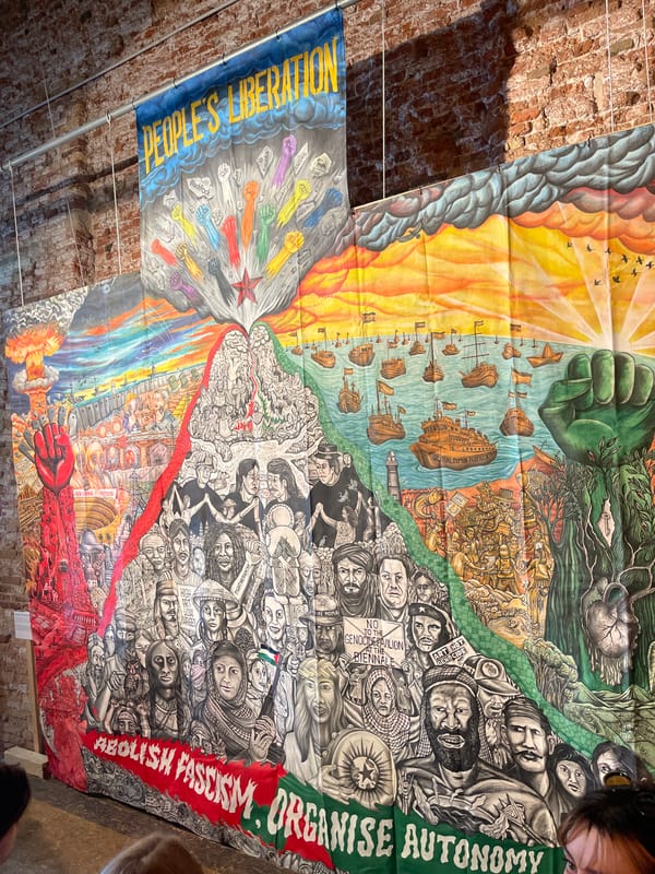 Political art banners displayed in Venice building interior