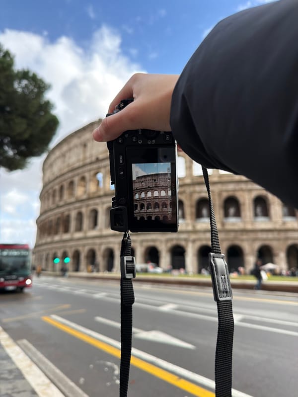 Tourist documents Colosseum visit with photos in Rome