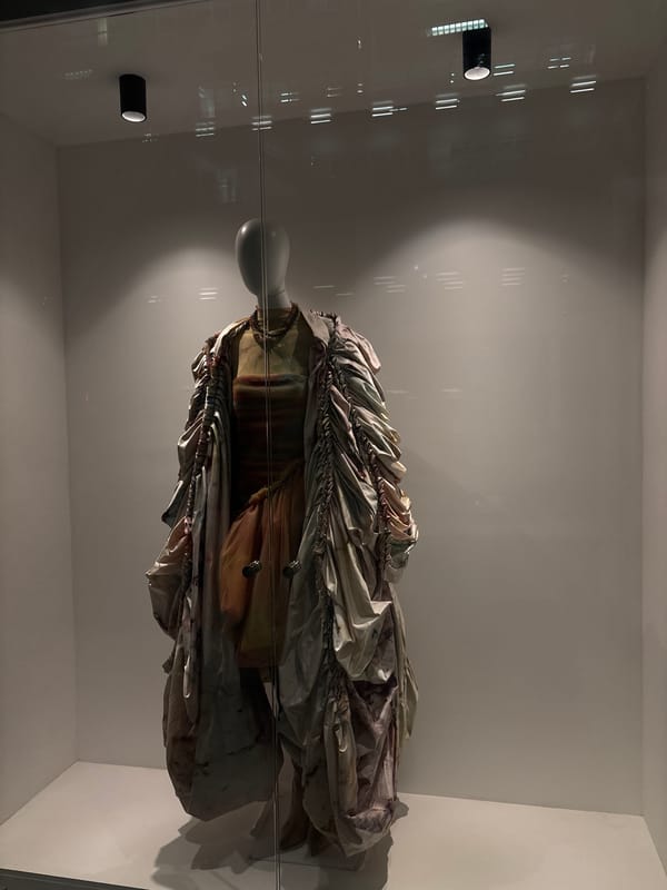 Elaborate garment exhibited in glass case at Mexico City museum