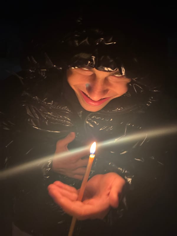 Person uses makeshift lighting in darkness in Bulgarian village