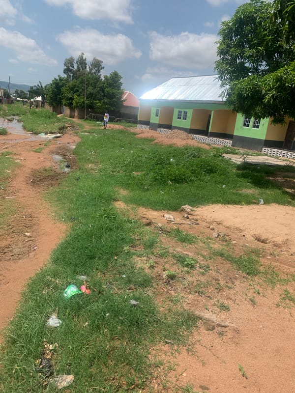 Daily life documented in Jalingo's residential dirt road neighborhoods