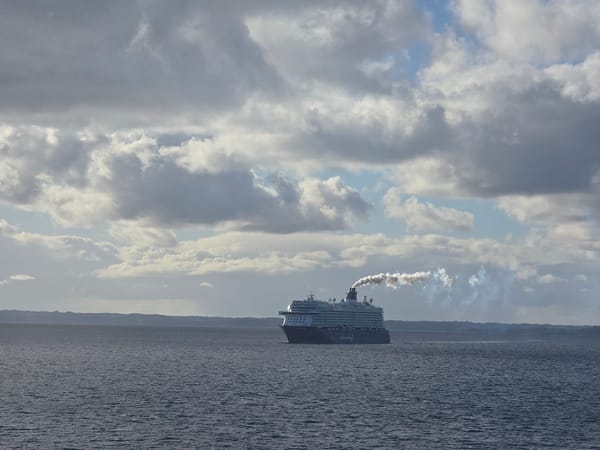 Cruise ship departs Stavanger waters under cloudy skies