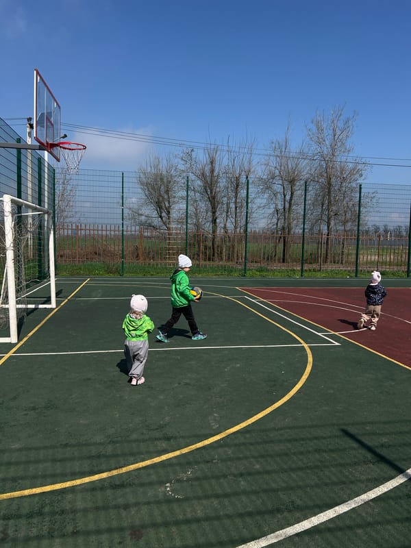 Children play at sports court in Leninakan, Russia