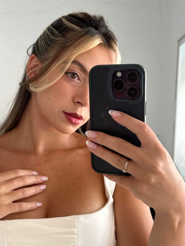 Mirror selfie in a Torremolinos room, summer 2026