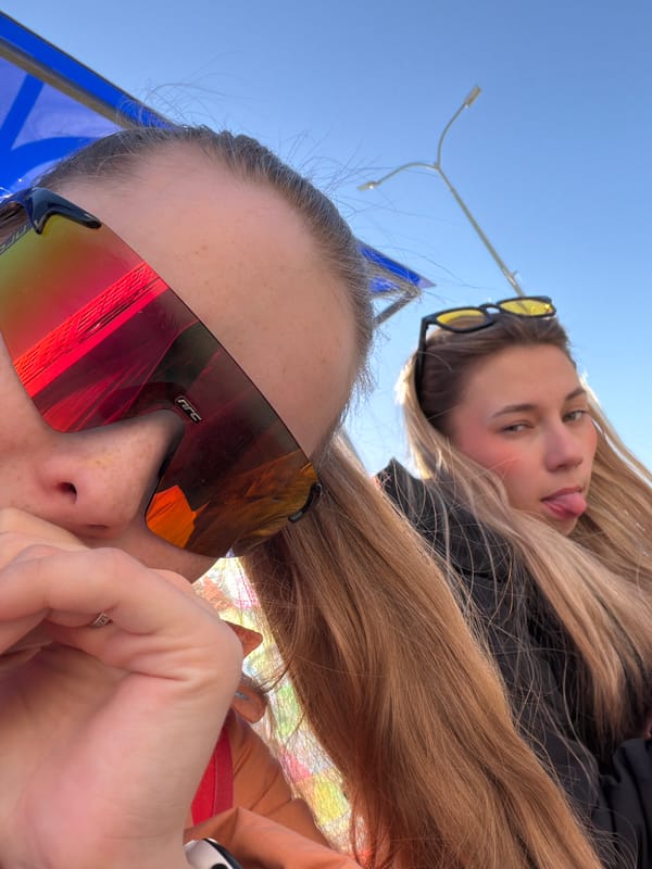 Two women take selfies outdoors in Berezniki, Russia