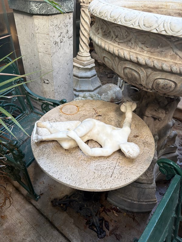 Marble statue observed in Buenos Aires garden courtyard