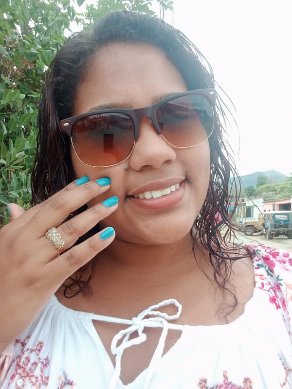 Women pose for photos in Parroquia Ocumare, Venezuela