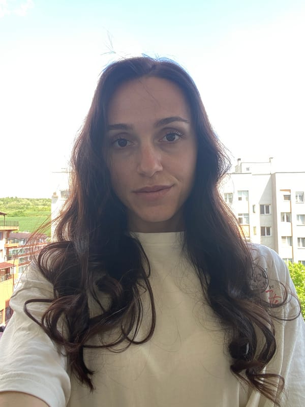 Woman takes selfie on balcony in Blagoevgrad, Bulgaria