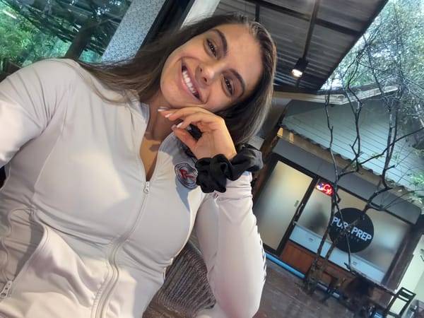 Woman takes selfie in tracksuit in Chalong, Thailand
