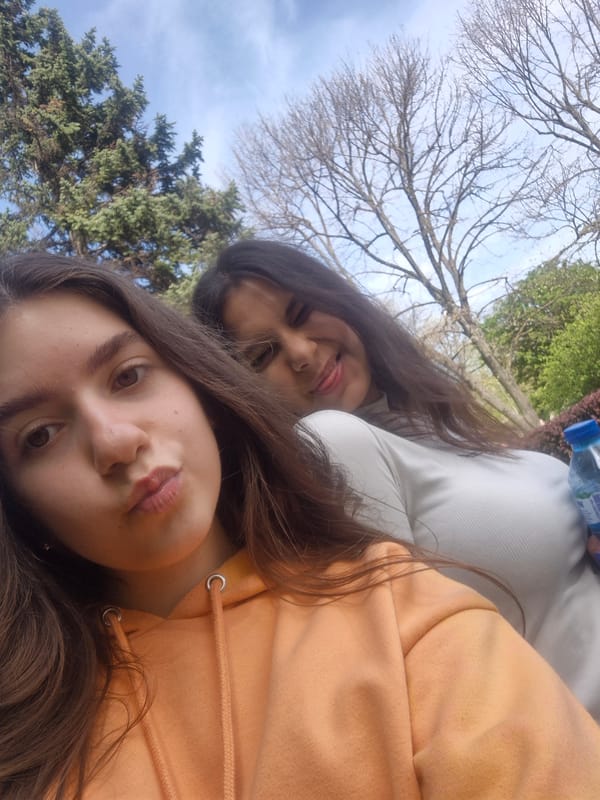 People walk along brick pathway in Pavlikeni, Bulgaria