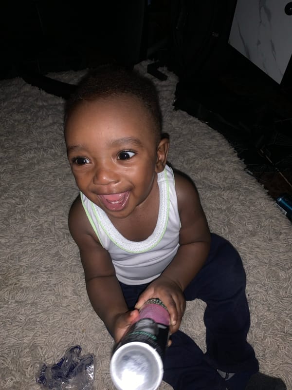 Toddler plays indoors in Barakin Akawo, Nigeria