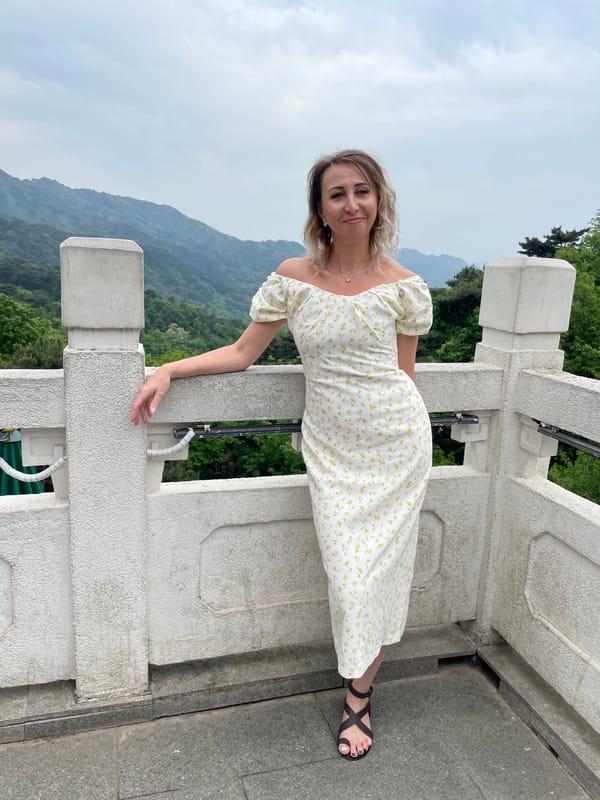 Morning tourists pose at scenic Huairou District overlook
