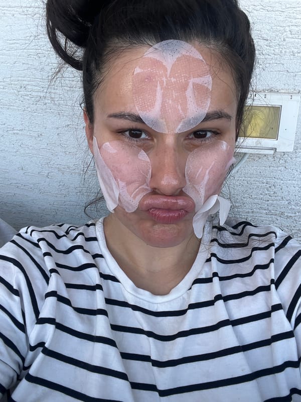 Woman uses facial patches during skincare routine in Kiryat Bialik
